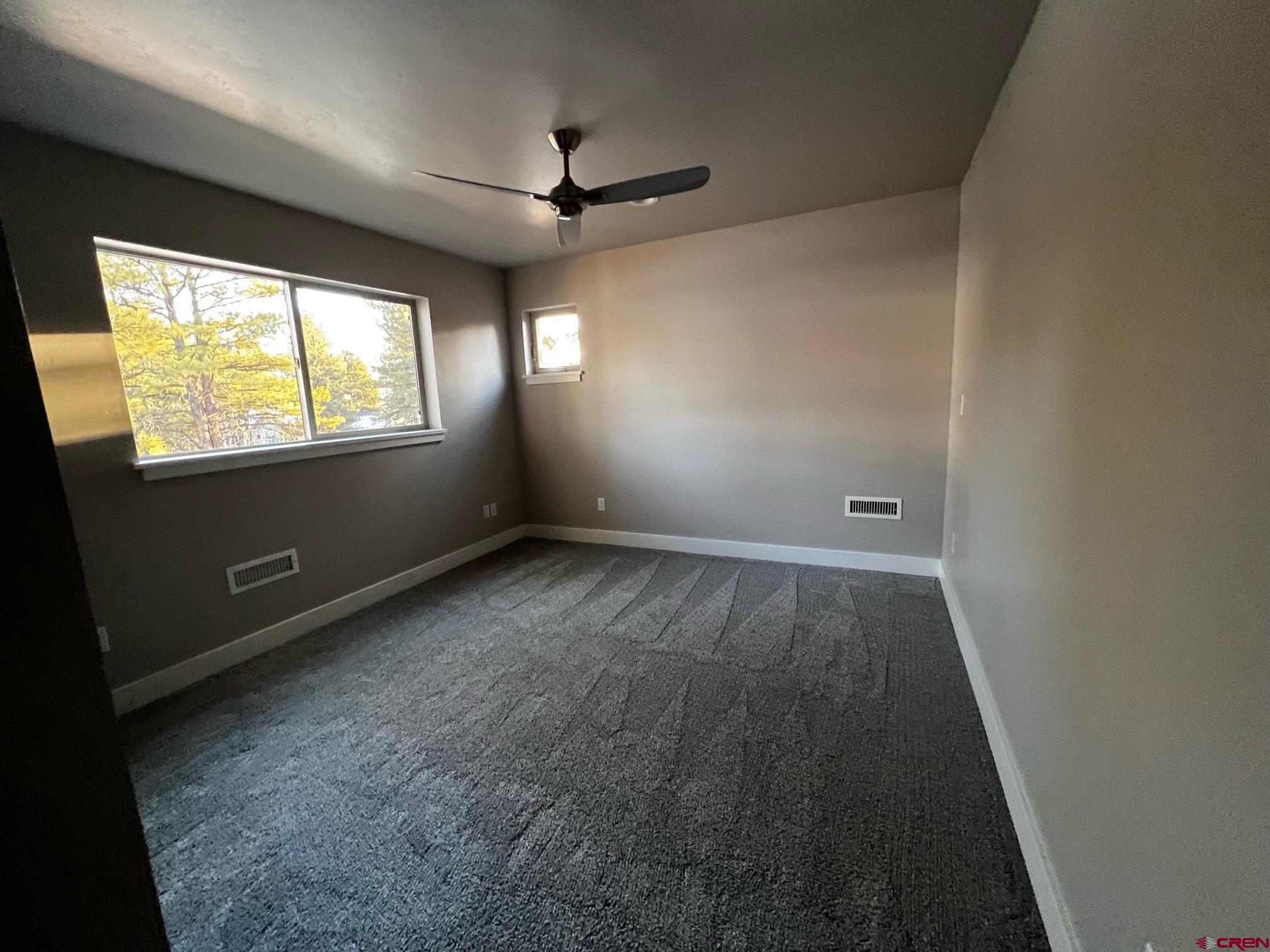250 Edgemont Meadows Road Durango, CO 81301 - Photo 10 of 10 an empty room with windows and entrance