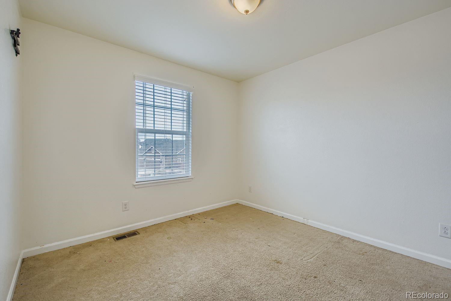 166 Bittern Drive Johnstown, CO 80534 - Photo 19 of 28 an empty room with a window