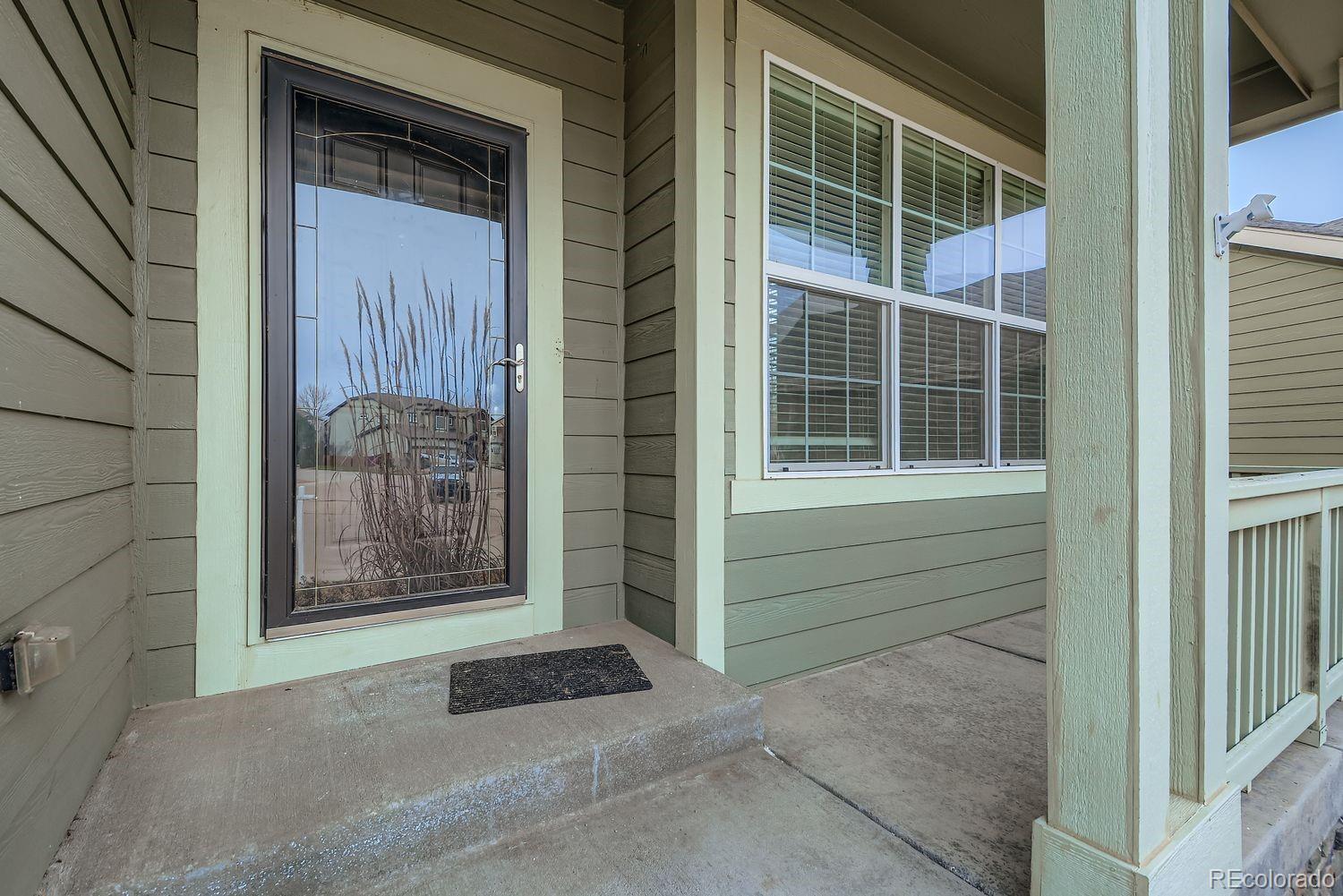 166 Bittern Drive Johnstown, CO 80534 - Photo 4 of 28 a front view of a house with a window