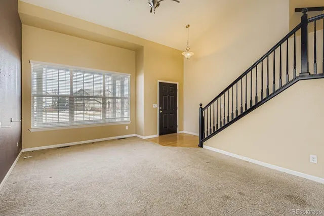 a view of an empty room with windows