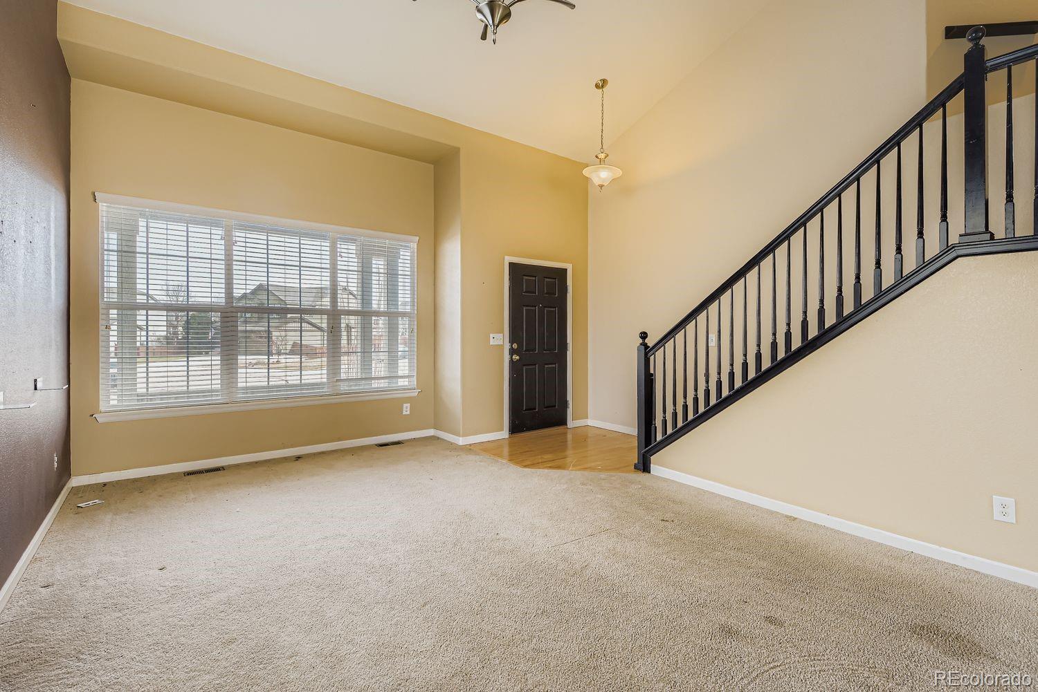 166 Bittern Drive Johnstown, CO 80534 - Photo 6 of 28 a view of an empty room with windows