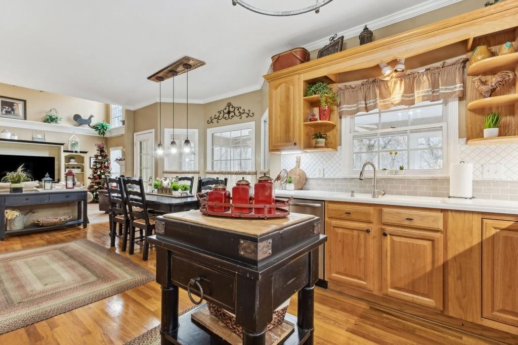 4385 Signal Ridge Court Buford, GA 30518 - Photo 21 of 81 a kitchen with stainless steel appliances granite countertop a stove a sink dishwasher and cabinets with wooden floor