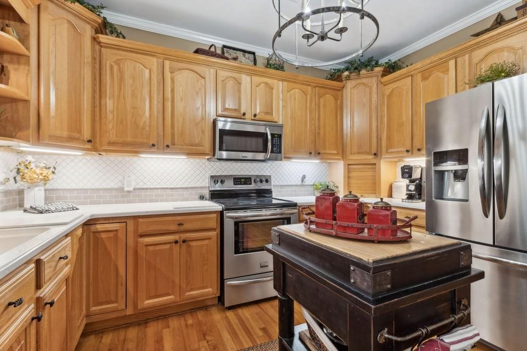 4385 Signal Ridge Court Buford, GA 30518 - Photo 23 of 81 a kitchen with a stove a sink and refrigerator