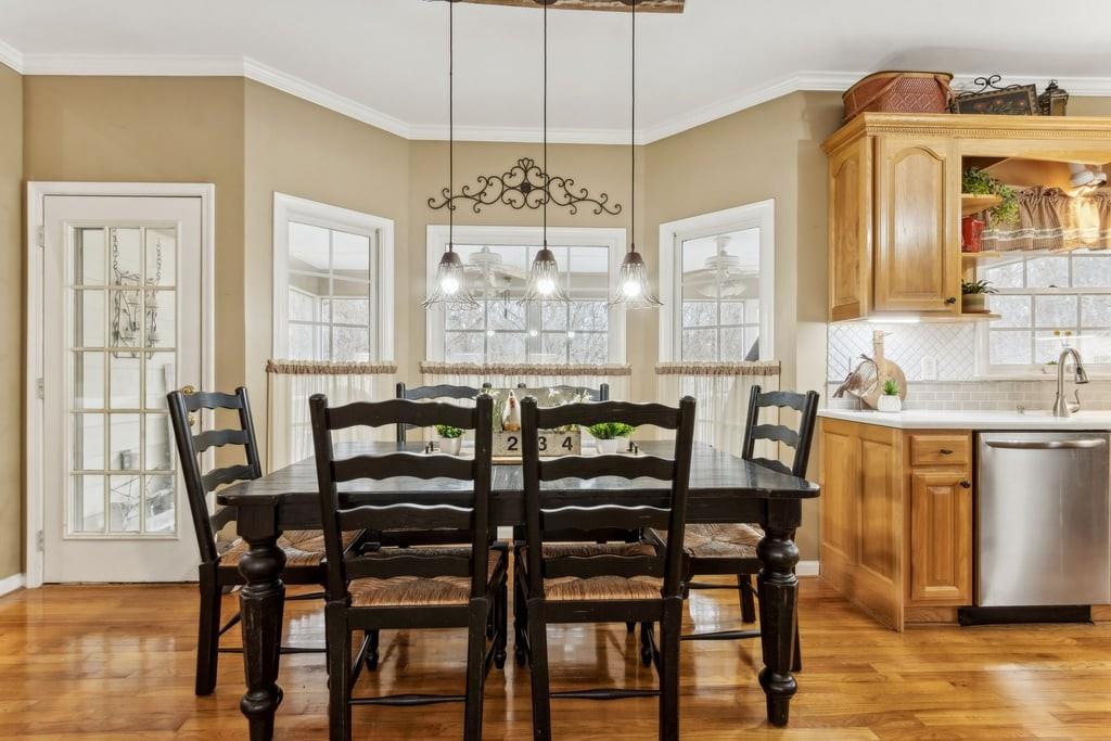 4385 Signal Ridge Court Buford, GA 30518 - Photo 24 of 81 a view of a a dining room with furniture window and wooden floor