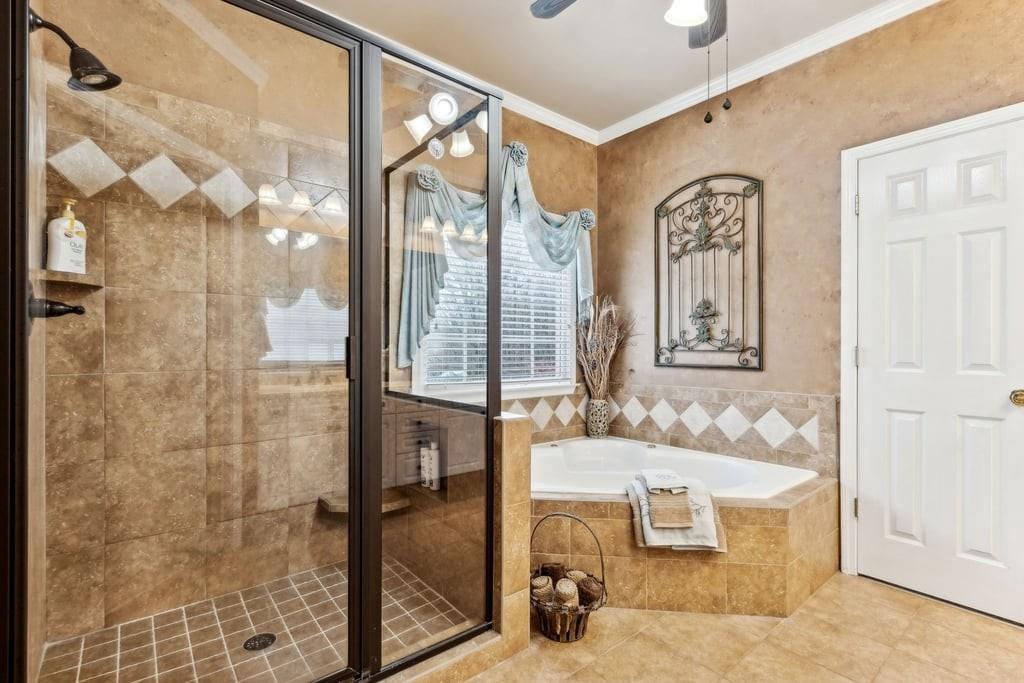 4385 Signal Ridge Court Buford, GA 30518 - Photo 33 of 81 a bathroom with a bathtub and shower