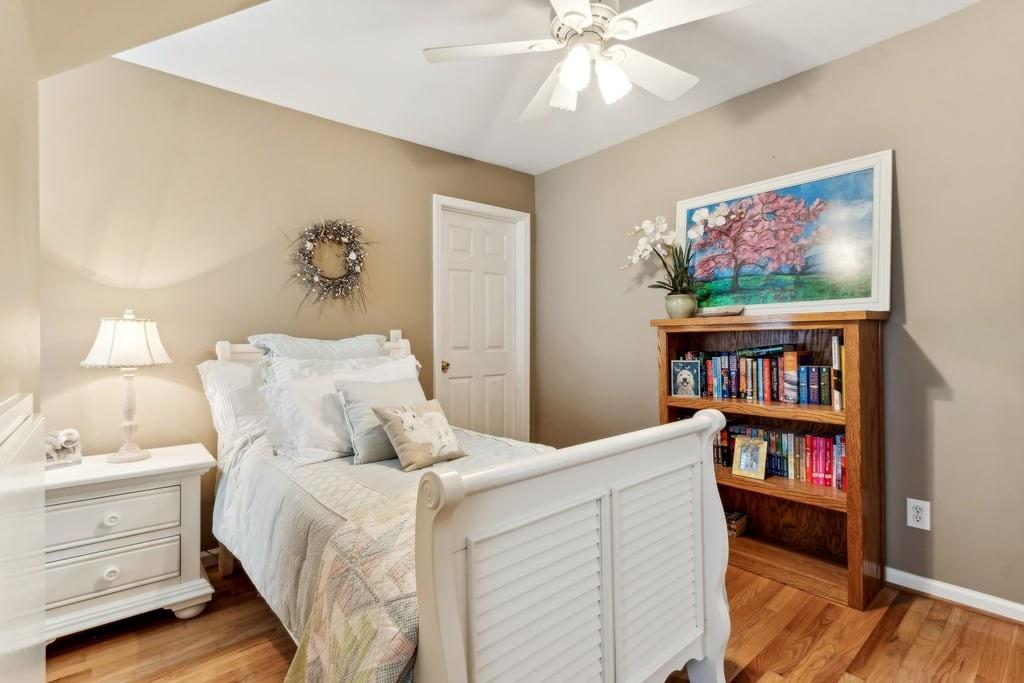 4385 Signal Ridge Court Buford, GA 30518 - Photo 40 of 81 a bedroom with a bed and a bookshelf