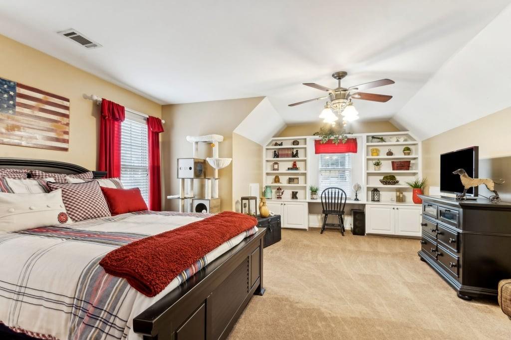 4385 Signal Ridge Court Buford, GA 30518 - Photo 42 of 81 a bedroom with a bed and a flat screen tv