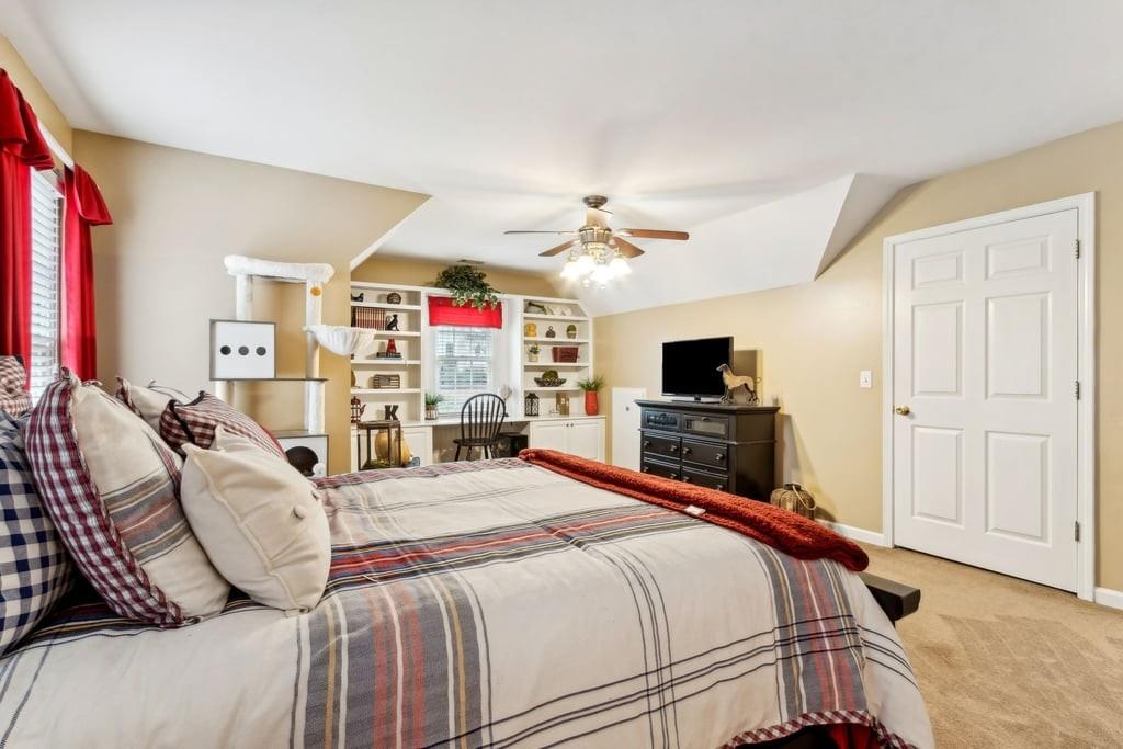 4385 Signal Ridge Court Buford, GA 30518 - Photo 44 of 81 a bedroom with a bed and a flat screen tv