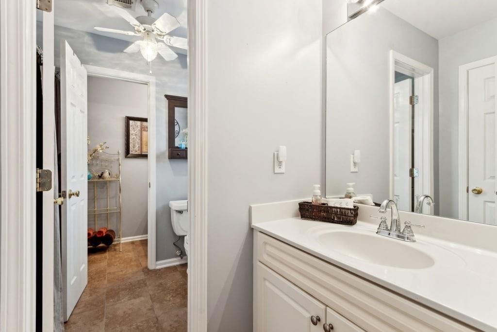 4385 Signal Ridge Court Buford, GA 30518 - Photo 45 of 81 a en suite bathroom with a double vanity sink and a mirror