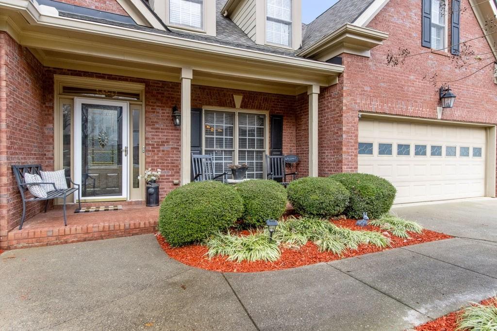 4385 Signal Ridge Court Buford, GA 30518 - Photo 5 of 81 front view of a brick house with a small yard