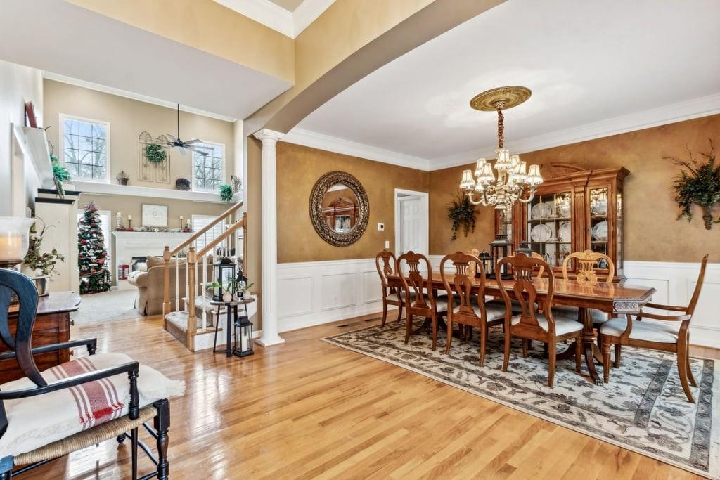 4385 Signal Ridge Court Buford, GA 30518 - Photo 69 of 81 a view of a dining room with furniture window and wooden floor