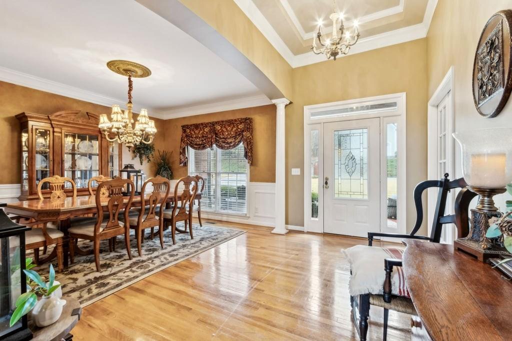 4385 Signal Ridge Court Buford, GA 30518 - Photo 7 of 81 a view of a dining room with furniture window and wooden floor