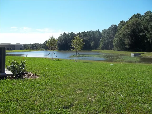 a view of a lake with a big yard