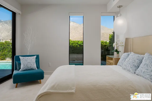 a bedroom with a bed and a couch