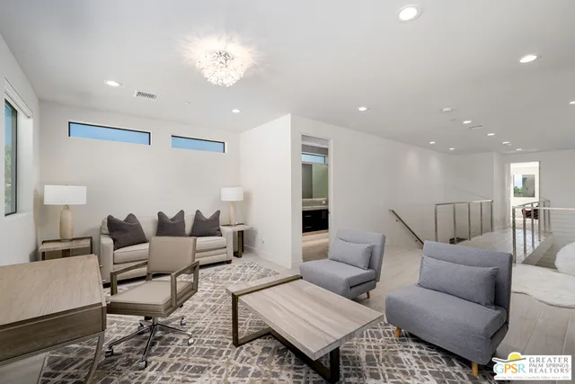 a living room with furniture and a table