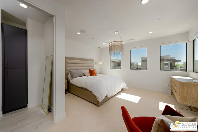 a bedroom with a bed and furniture