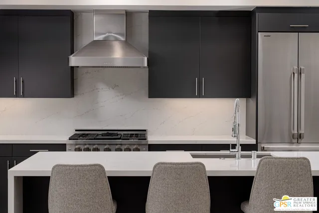 a kitchen with a sink and a stove