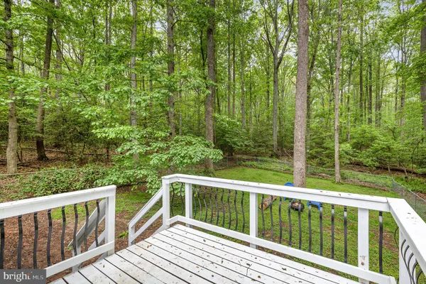 a view of balcony with deck and trees