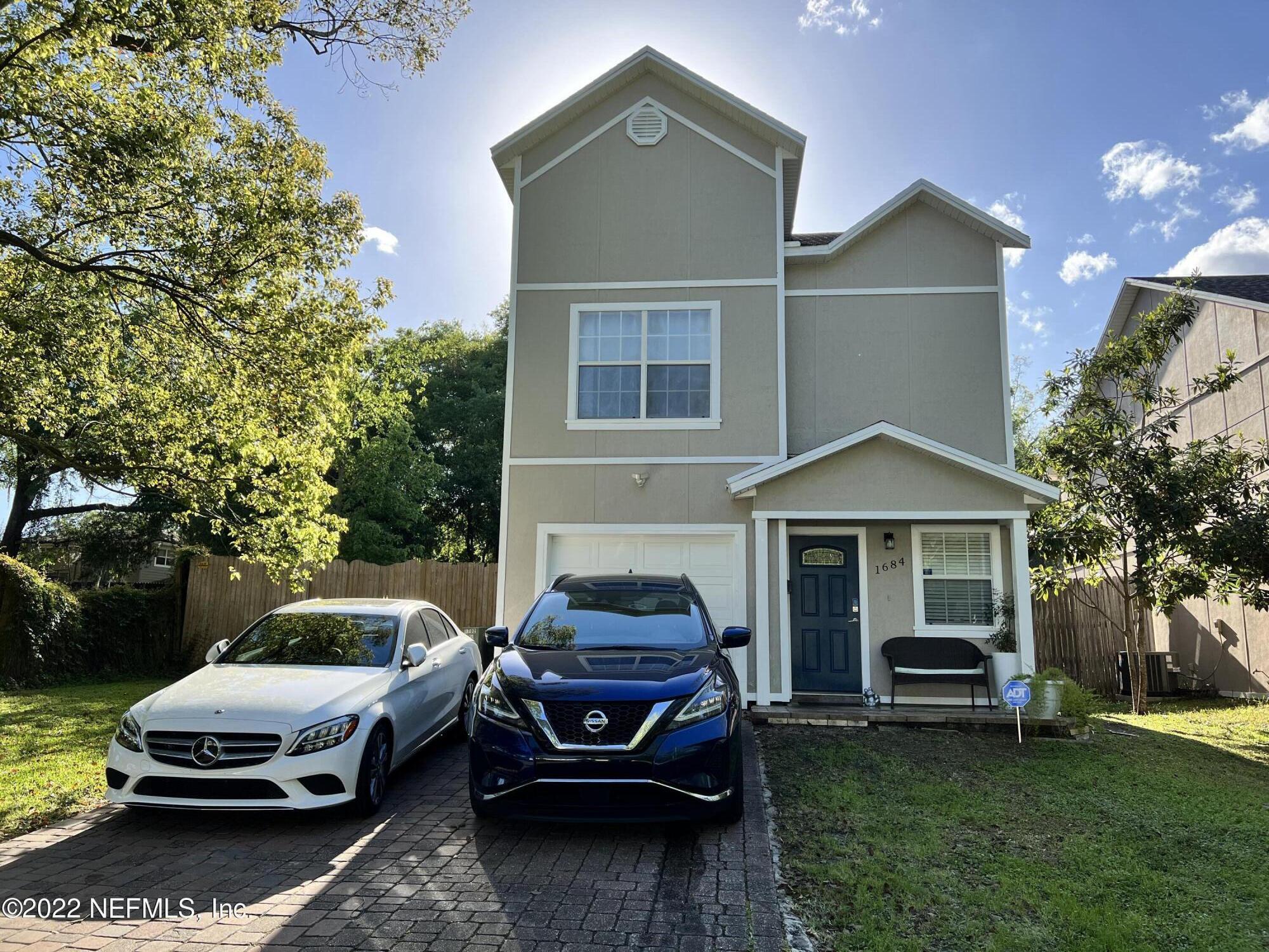 1684 Mayfair Road Jacksonville, FL 32207 - Photo 1 of 34 a car parked in front of a house