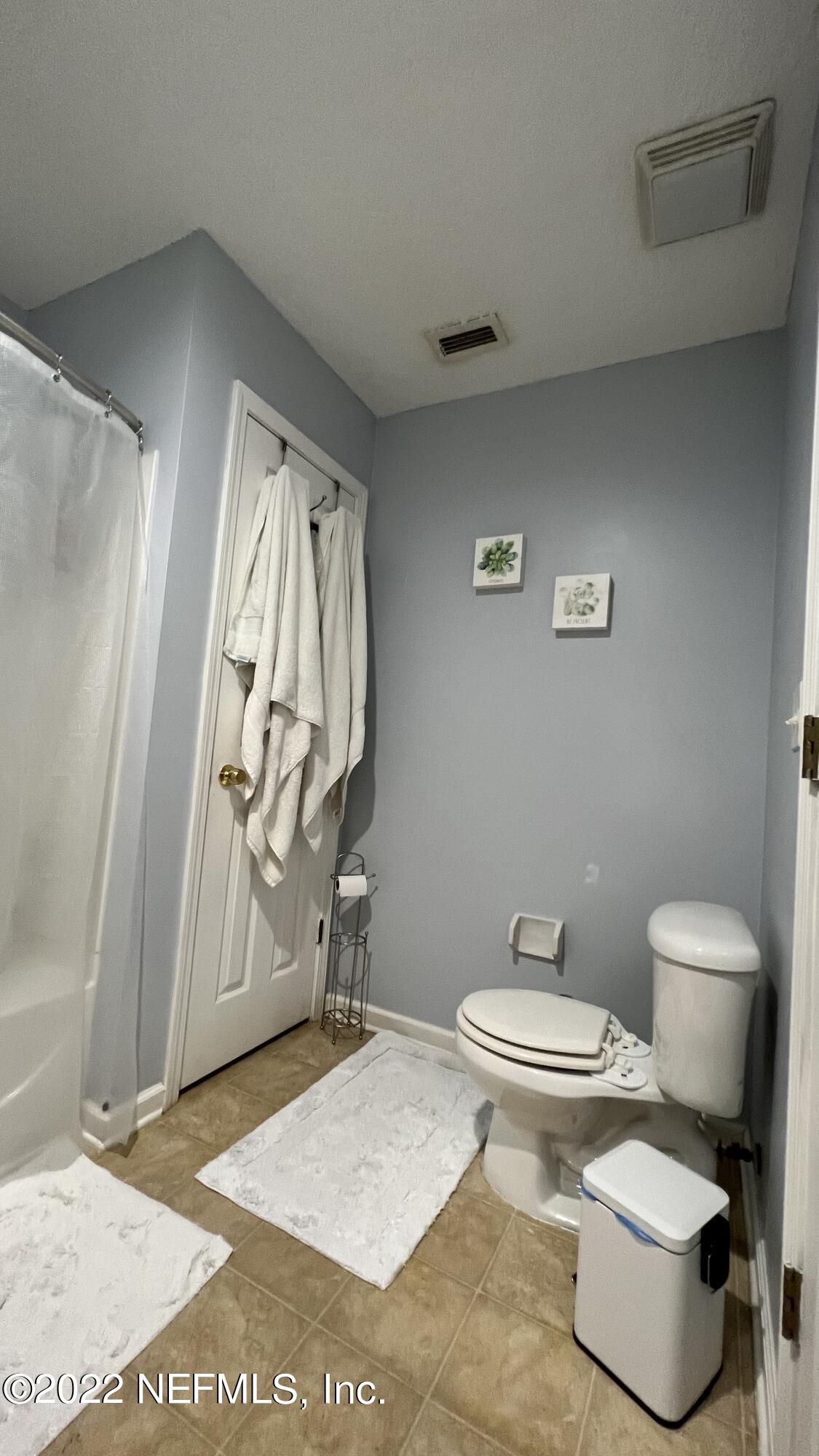 1684 Mayfair Road Jacksonville, FL 32207 - Photo 16 of 34 a bathroom with a toilet and a shower
