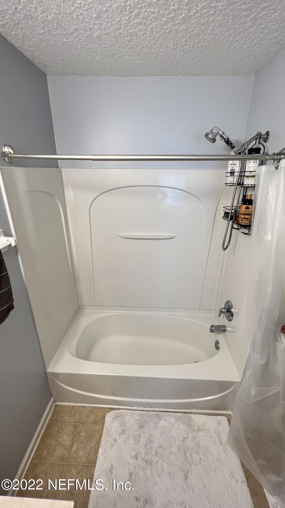 1684 Mayfair Road Jacksonville, FL 32207 - Photo 17 of 34 a bathroom with a bath tub