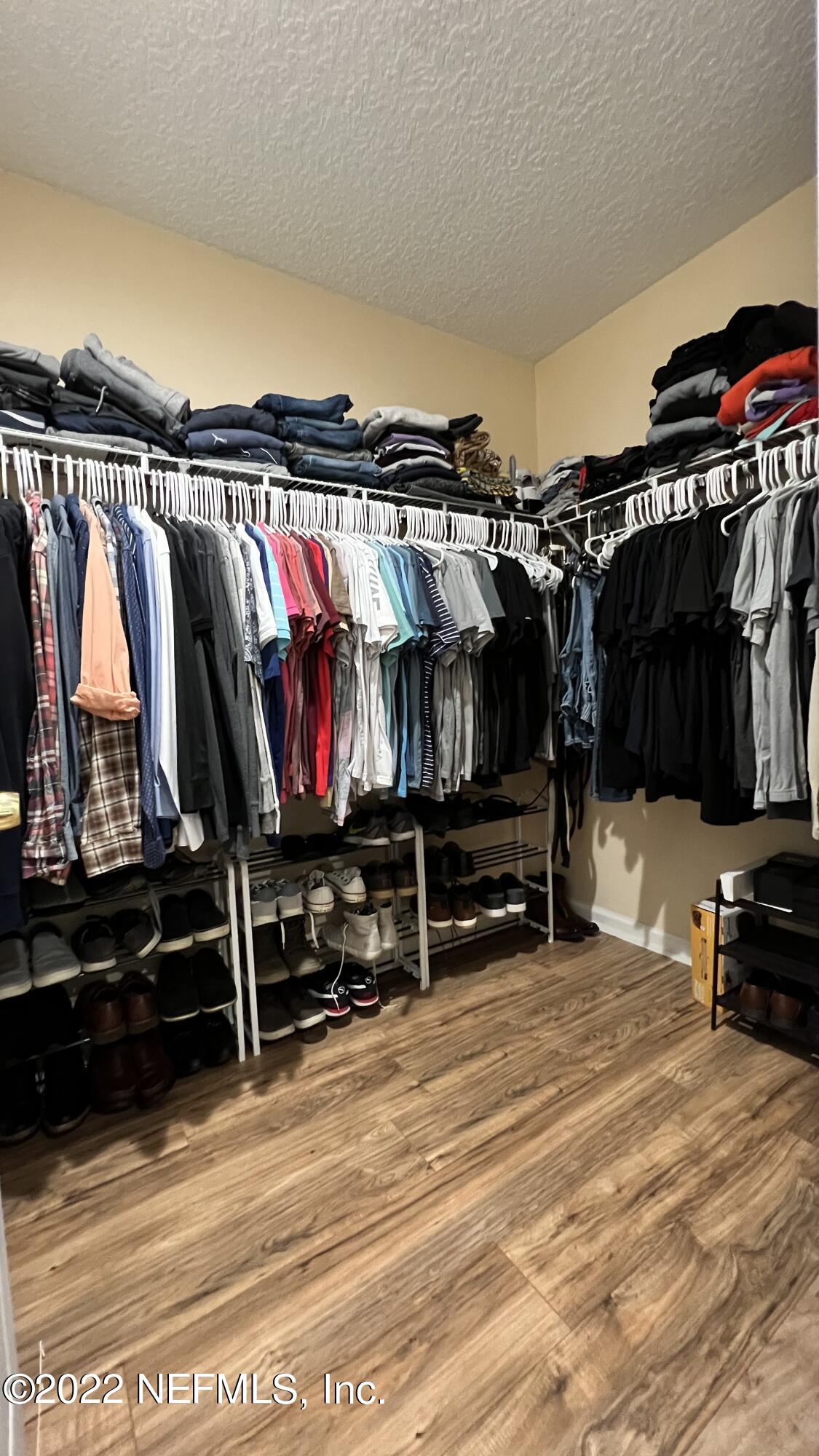 1684 Mayfair Road Jacksonville, FL 32207 - Photo 18 of 34 a view of walk in closet with clothes and shoes