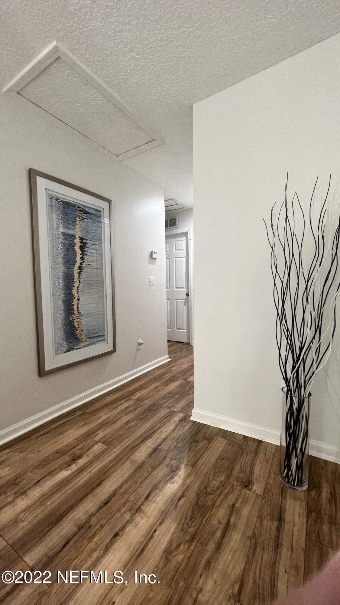1684 Mayfair Road Jacksonville, FL 32207 - Photo 19 of 34 a view of a room with wooden floor and a large window