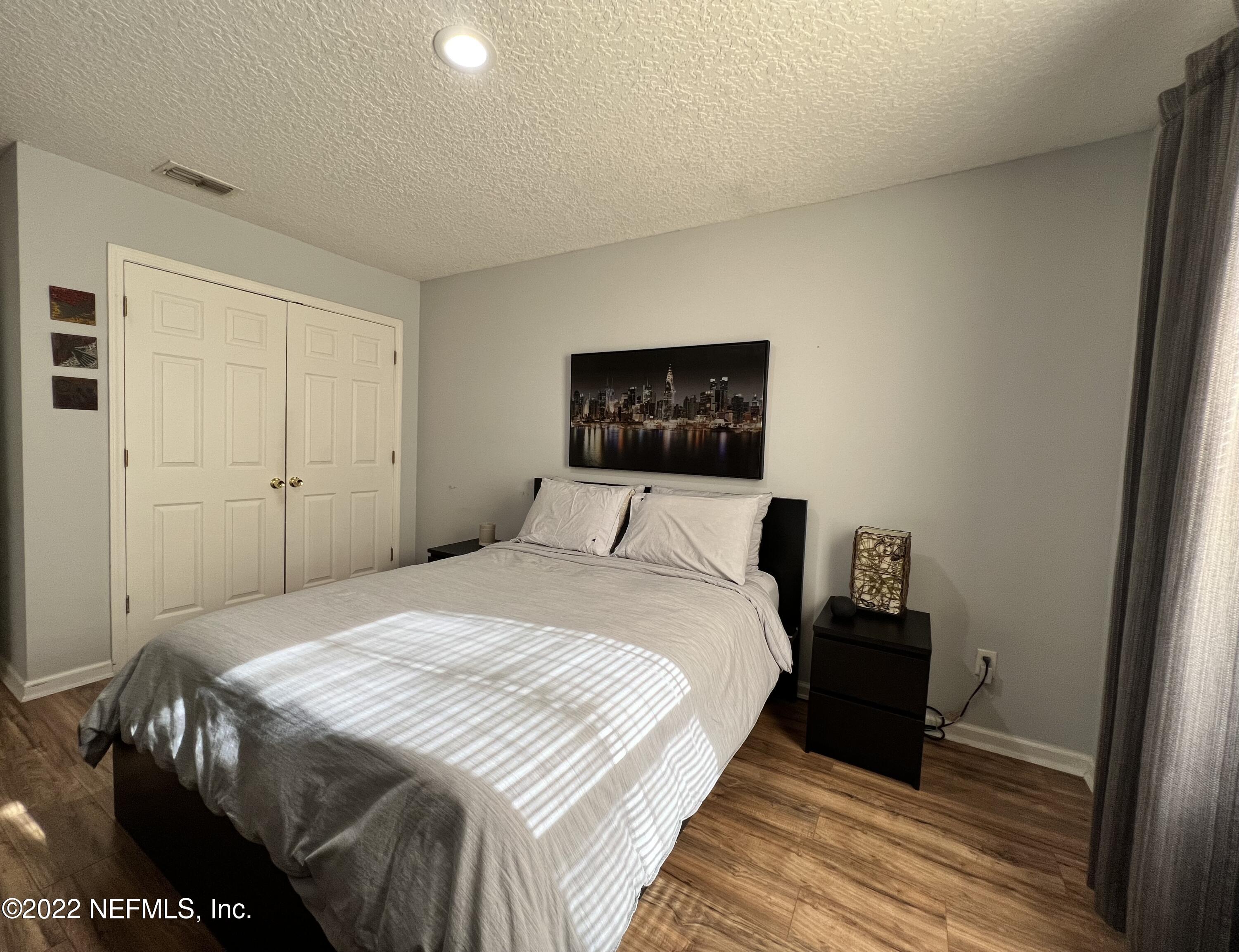 1684 Mayfair Road Jacksonville, FL 32207 - Photo 21 of 34 a bedroom with a bed and a mirror