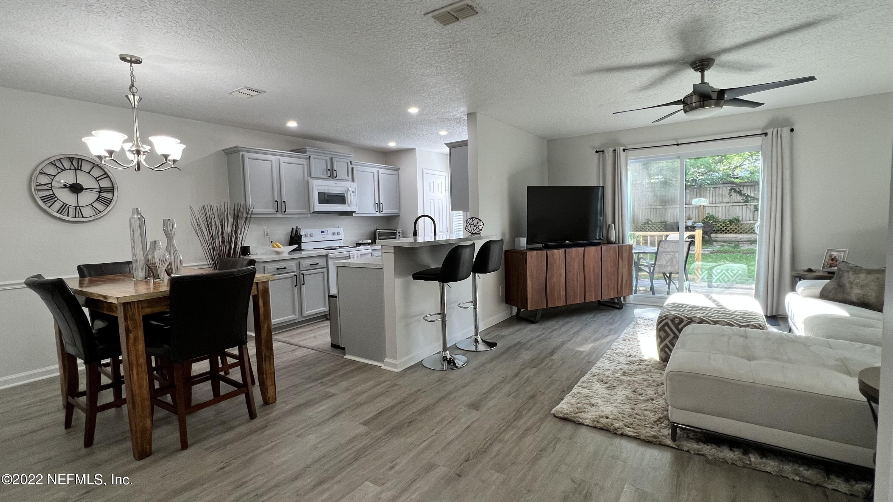 1684 Mayfair Road Jacksonville, FL 32207 - Photo 4 of 34 a living room with furniture and a flat screen tv
