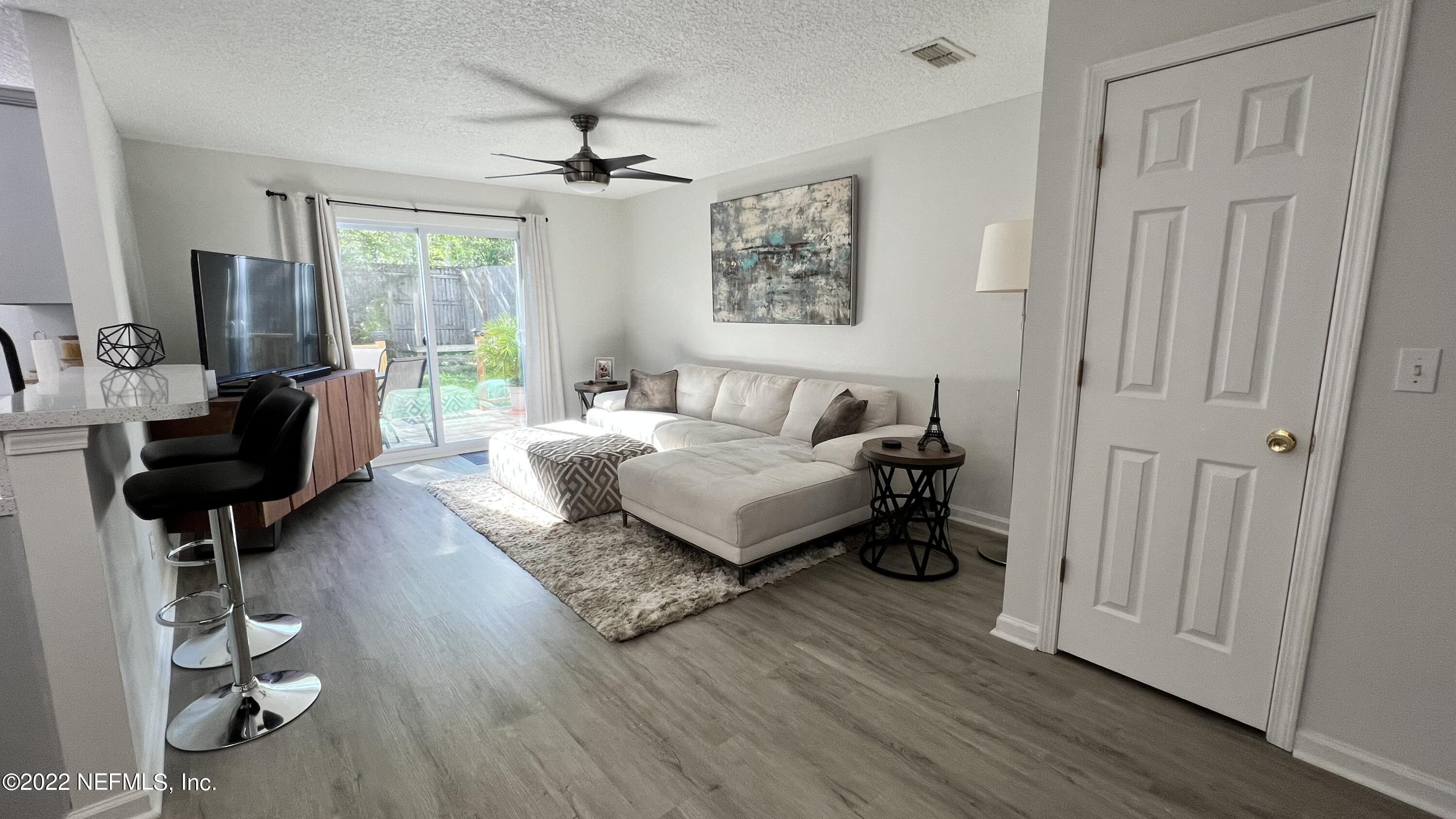 1684 Mayfair Road Jacksonville, FL 32207 - Photo 5 of 34 a living room with furniture and a wooden floor