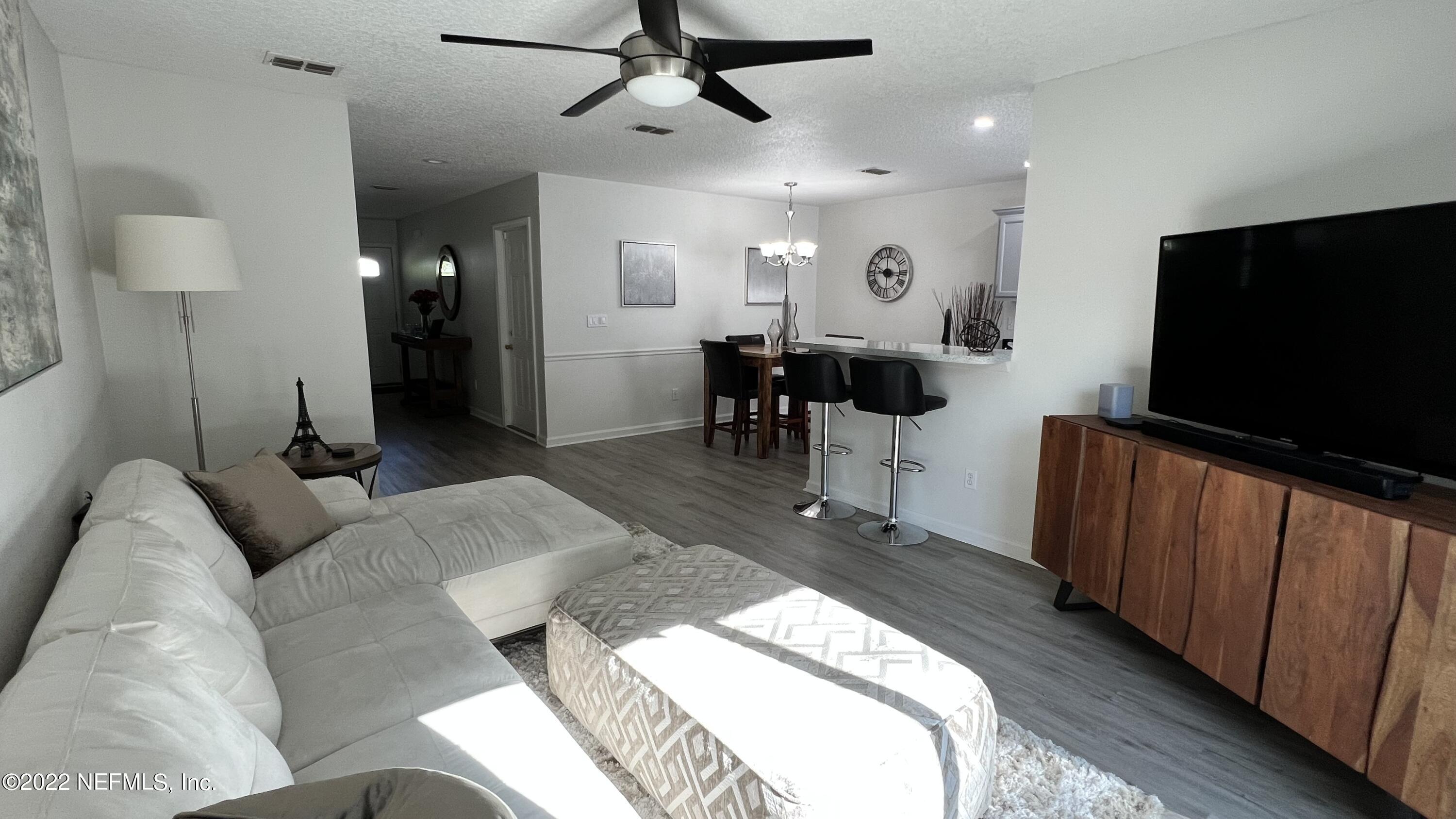 1684 Mayfair Road Jacksonville, FL 32207 - Photo 6 of 34 a living room with furniture and a flat screen tv
