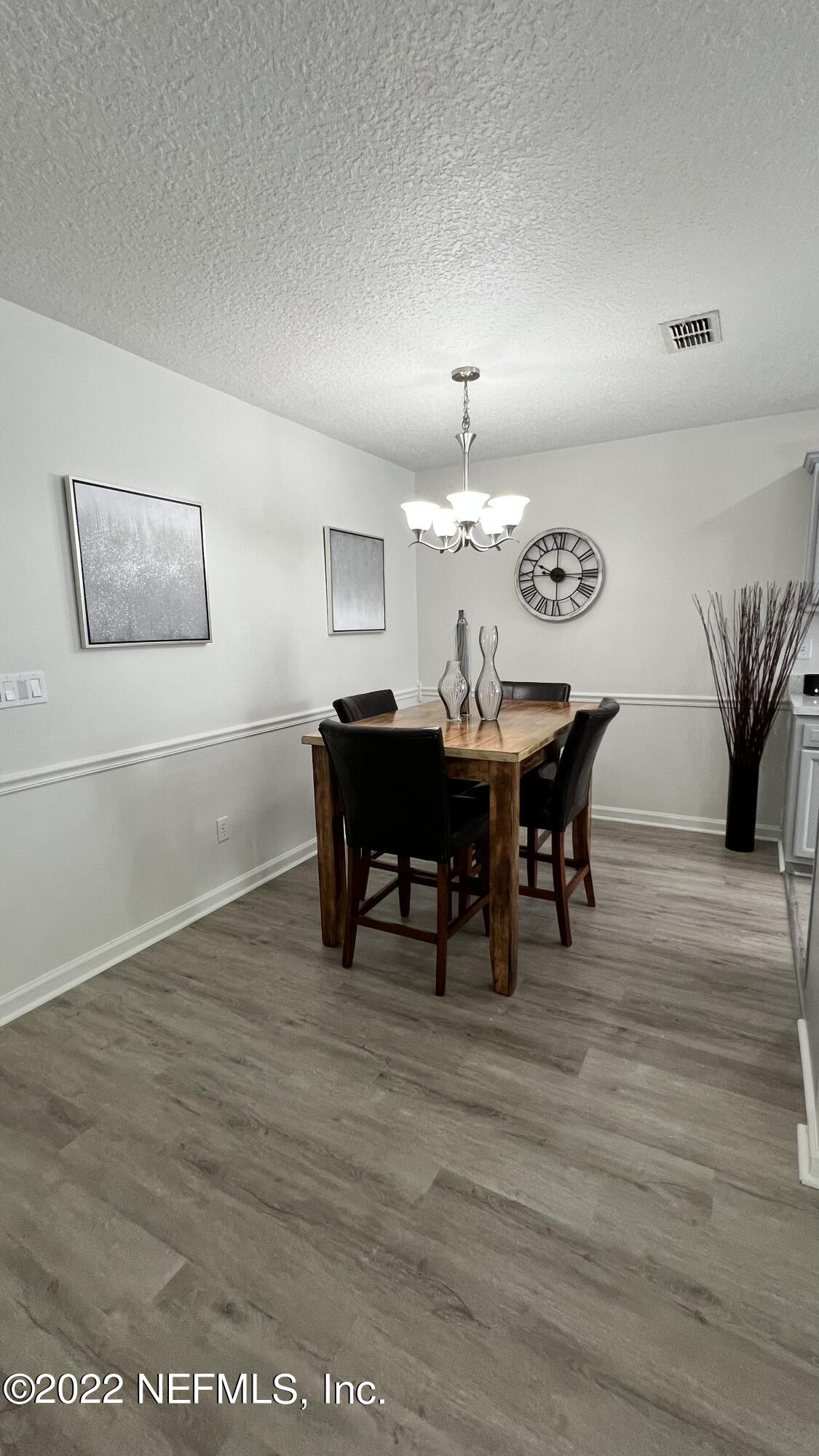 1684 Mayfair Road Jacksonville, FL 32207 - Photo 7 of 34 a view of a dining room with furniture