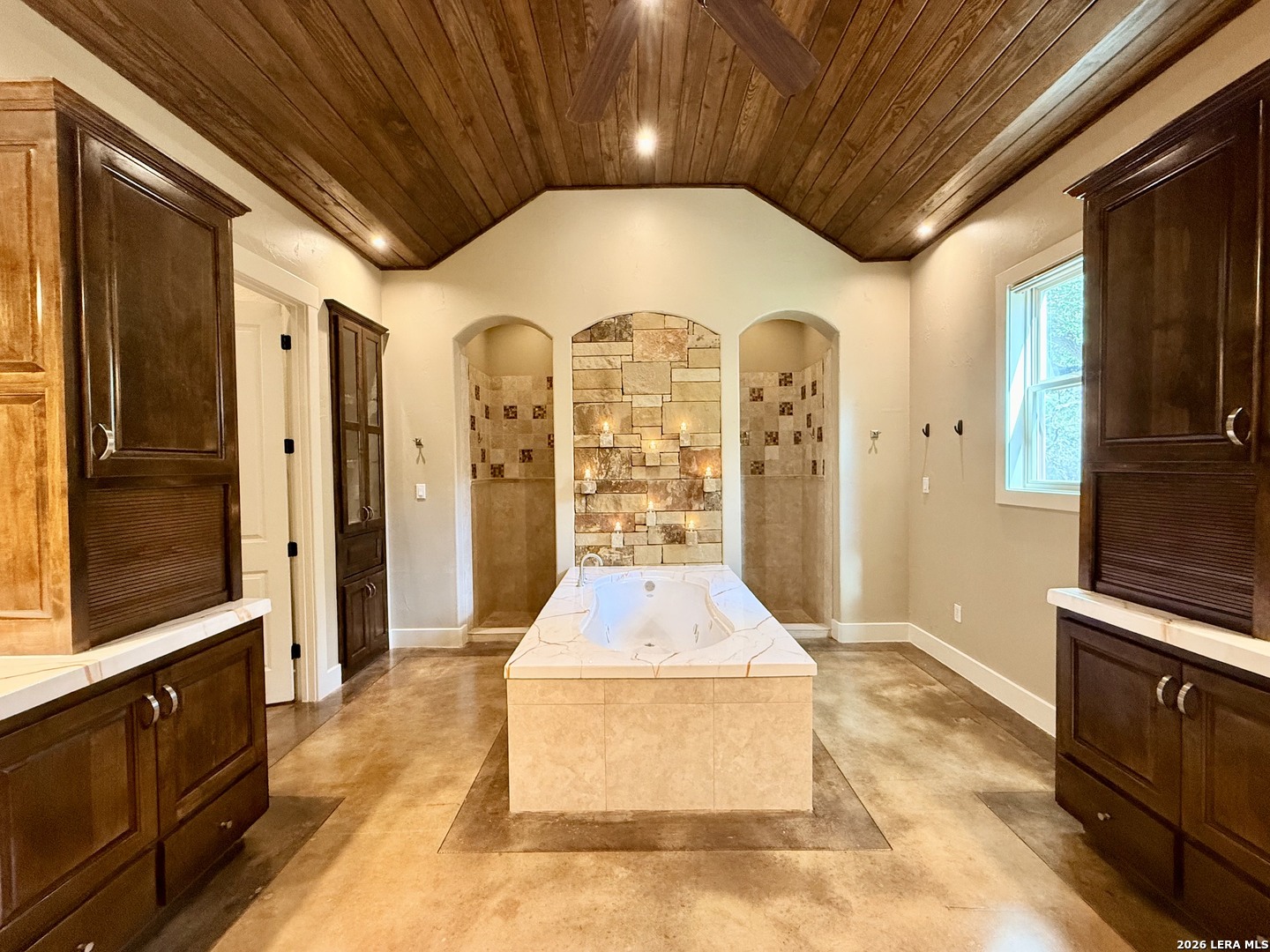757 Copper Rim Spring Branch, TX 78070 - Photo 24 of 50 a hall with stainless steel appliances granite countertop a stove a refrigerator and wooden cabinets