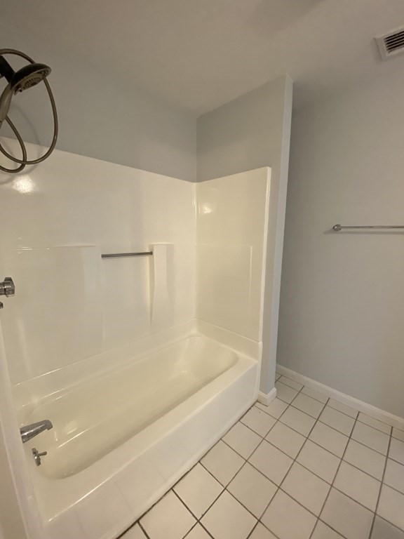 1047 Washington Street, Unit 2 Newton, MA 02465 - Photo 11 of 20 a bathroom with a bathtub