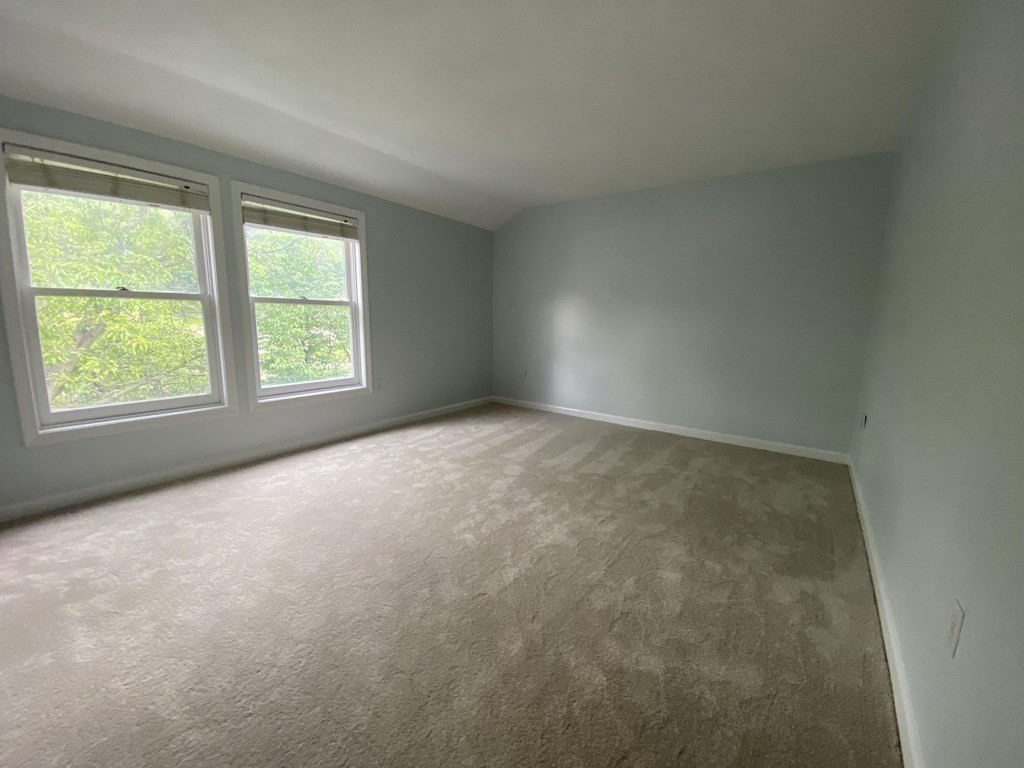 1047 Washington Street, Unit 2 Newton, MA 02465 - Photo 8 of 20 an empty room with a window