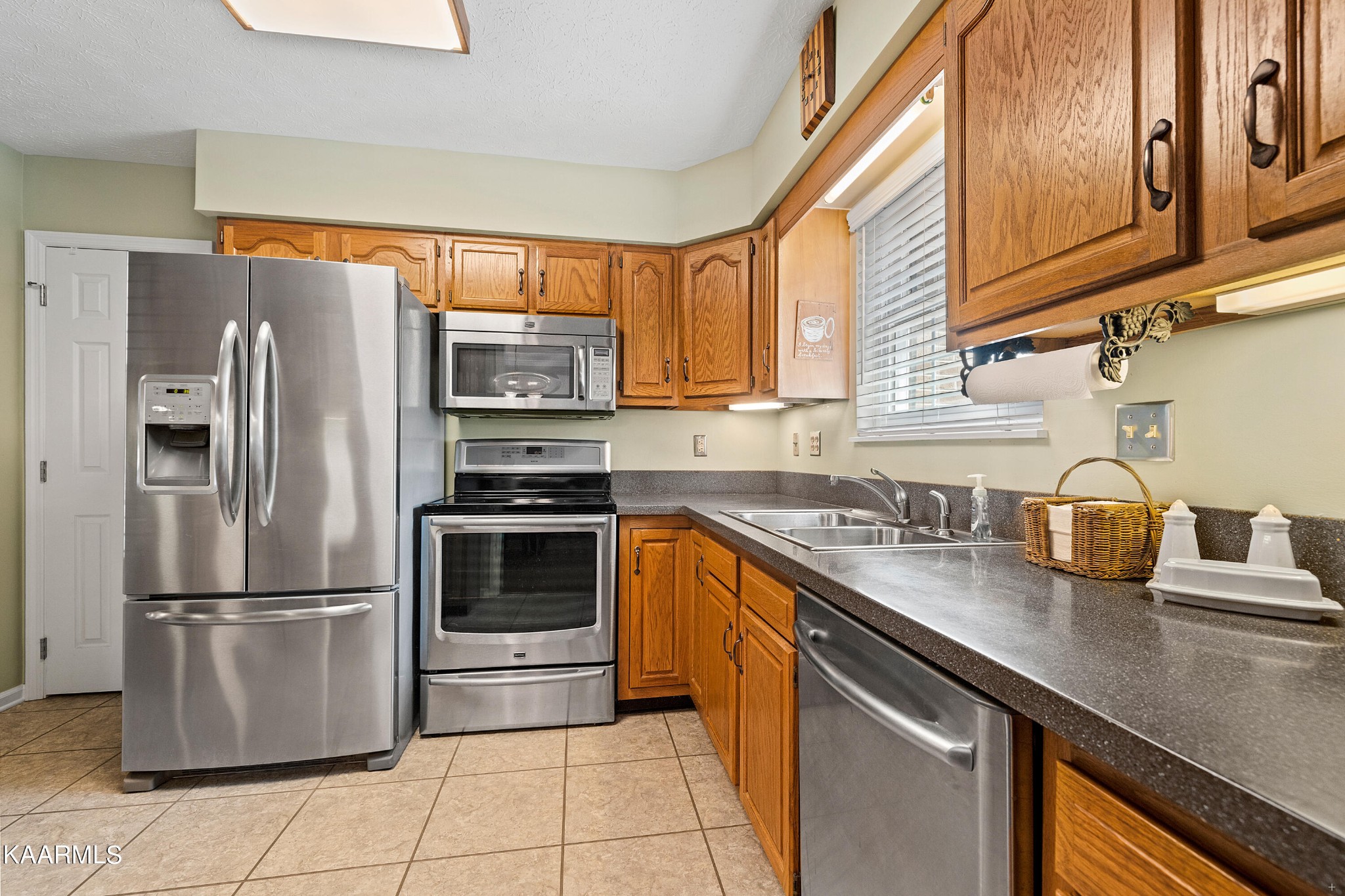 114 Capital Circle Oak Ridge, TN 37830 - Photo 18 of 50 a kitchen with stainless steel appliances granite countertop a refrigerator a stove and a sink