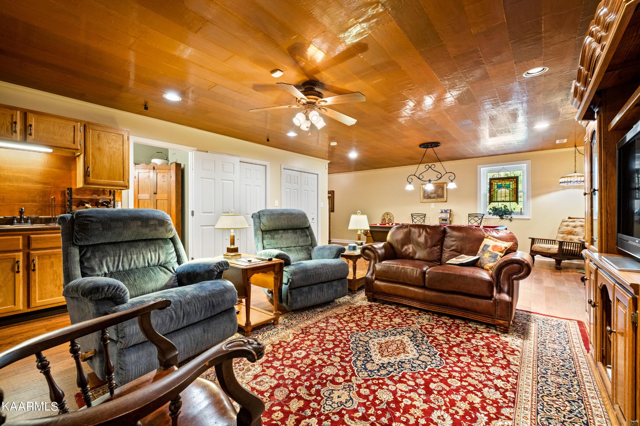114 Capital Circle Oak Ridge, TN 37830 - Photo 32 of 50 a living room with furniture a rug and a chandelier