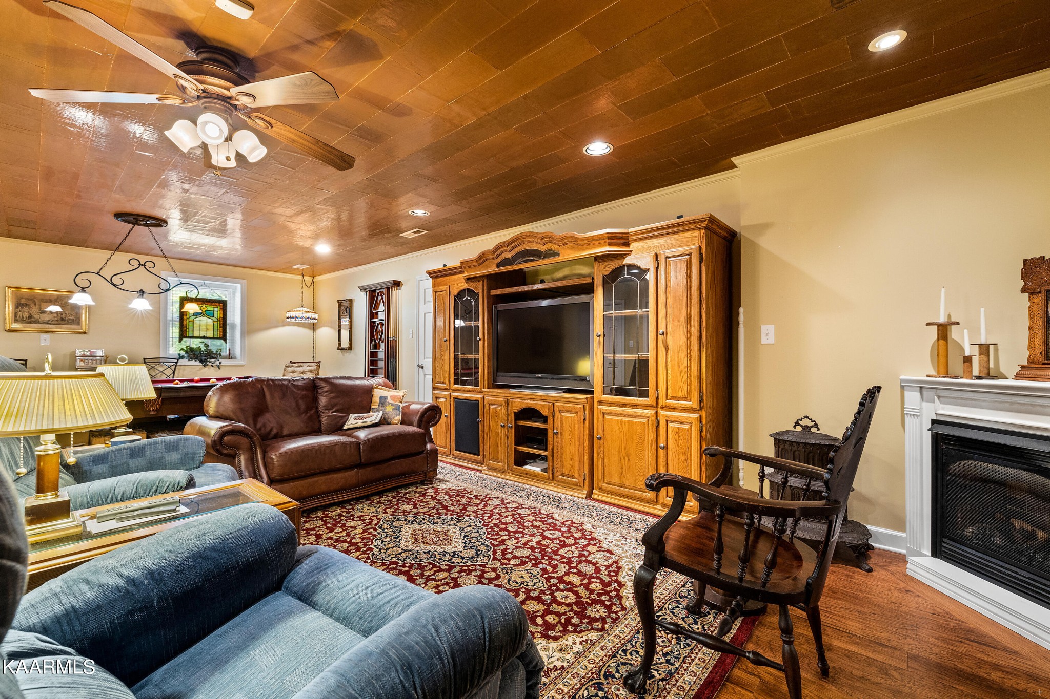 114 Capital Circle Oak Ridge, TN 37830 - Photo 36 of 50 a living room with furniture a flat screen tv and a fireplace