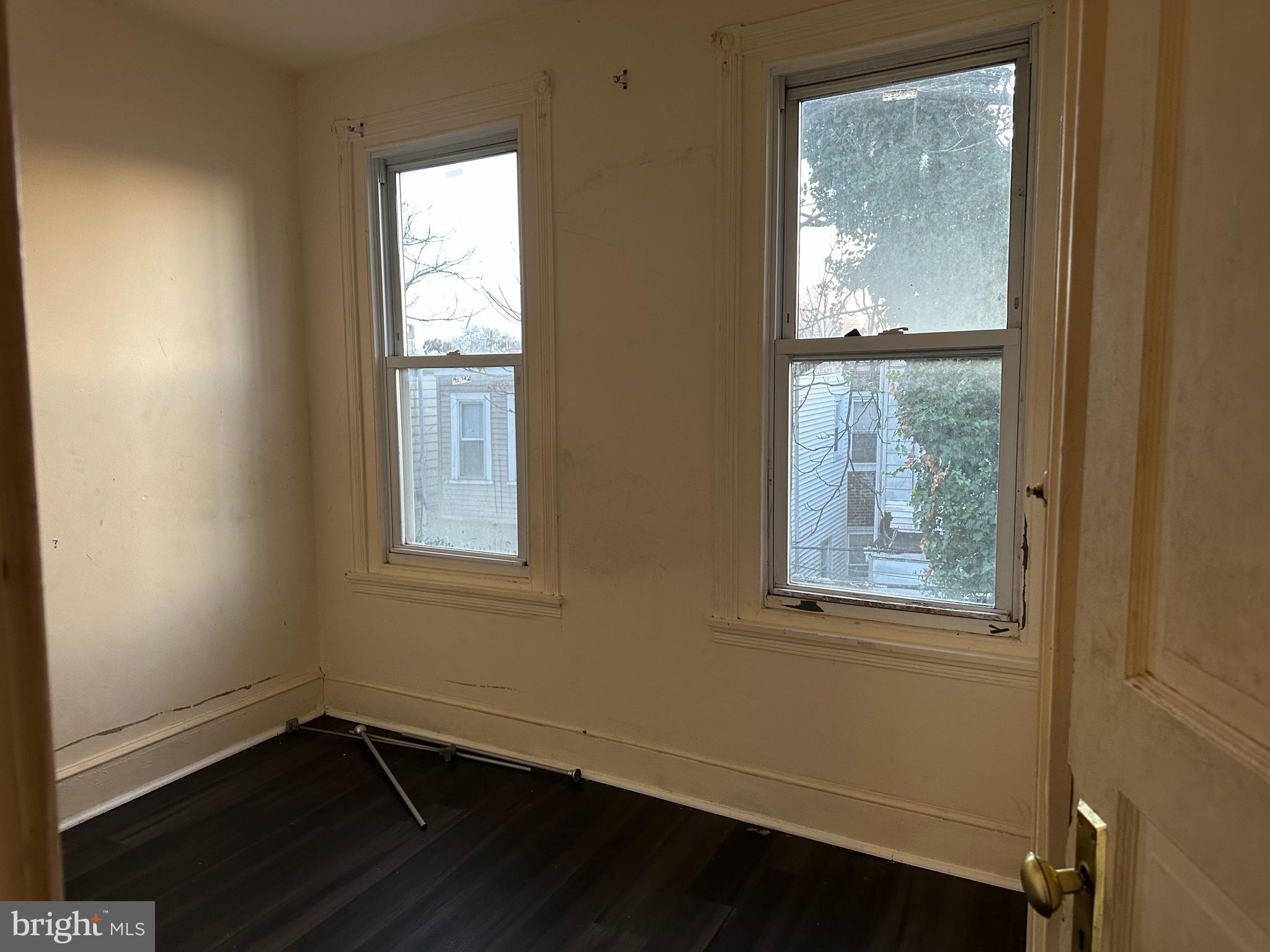 1656 Granite Street Philadelphia, PA 19124 - Photo 9 of 10 a view of an empty room with wooden floor and a window