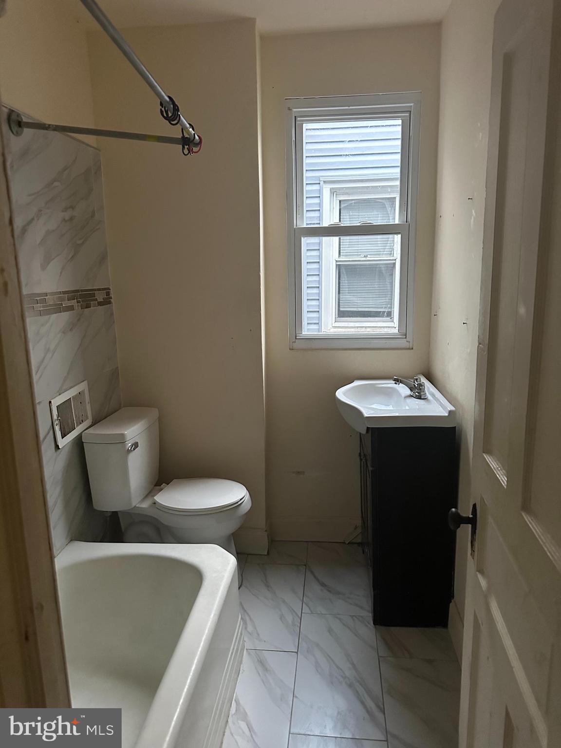 1656 Granite Street Philadelphia, PA 19124 - Photo 10 of 10 a bathroom with a toilet and a sink