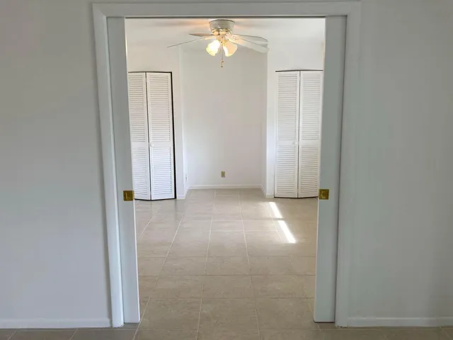 an empty room with closet area