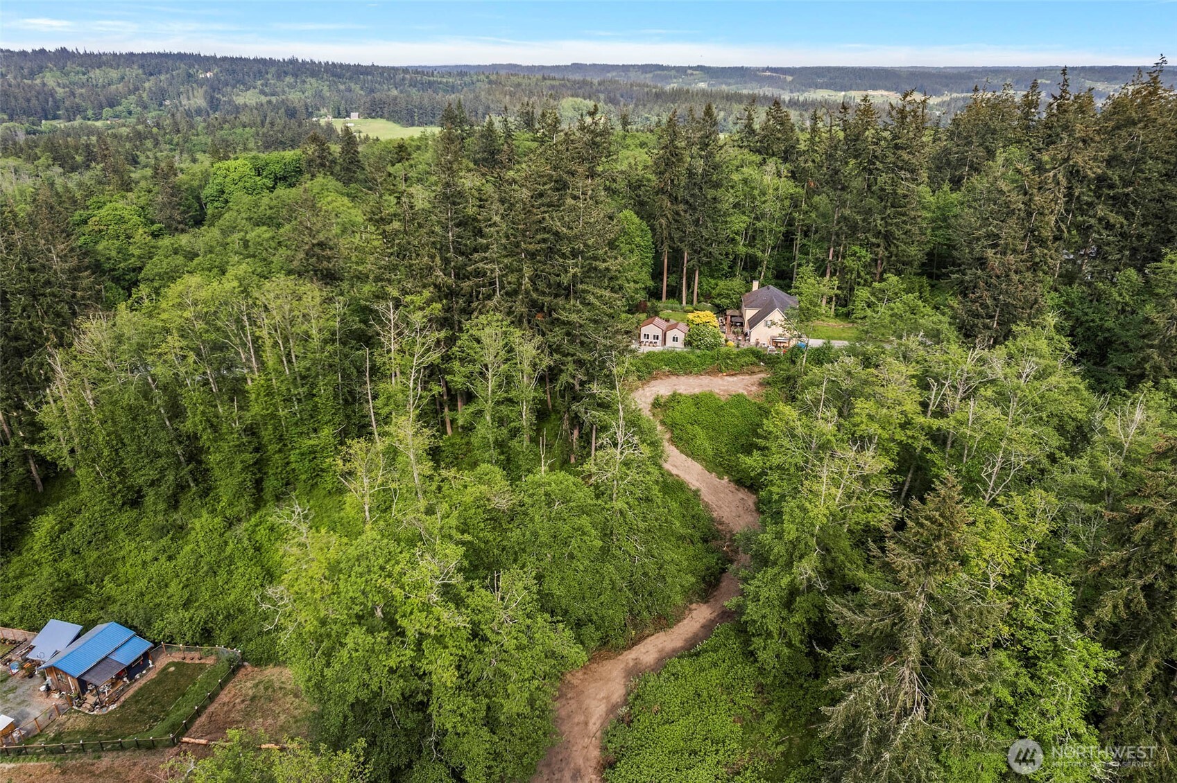 -xxx Osprey Road, Unit 152 Freeland, WA 98249 - Photo 11 of 14 a view of a forest with a lake