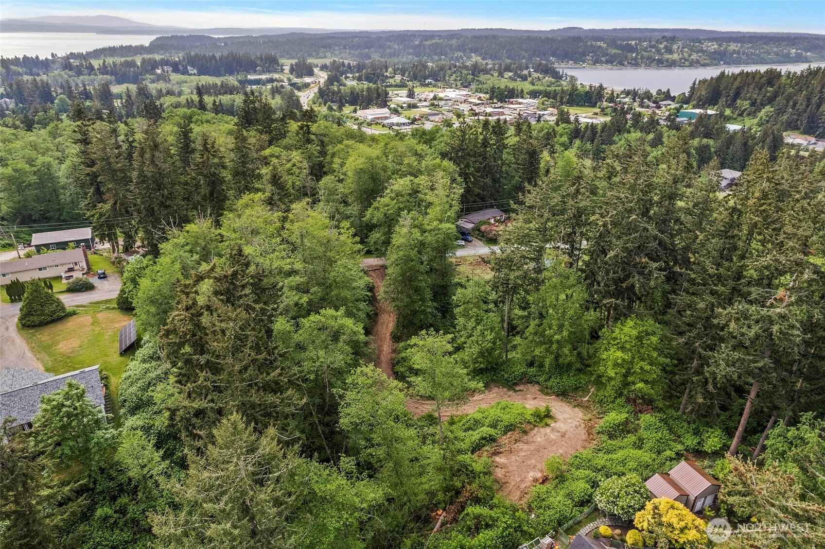 -xxx Osprey Road, Unit 152 Freeland, WA 98249 - Photo 7 of 14 an aerial view of a houses with a lush green hillside