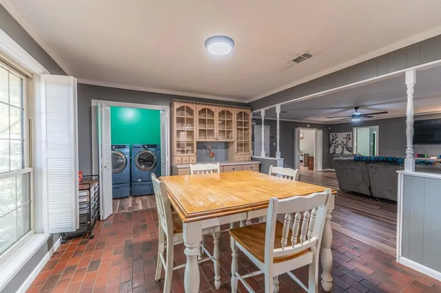 a dining room with furniture and window