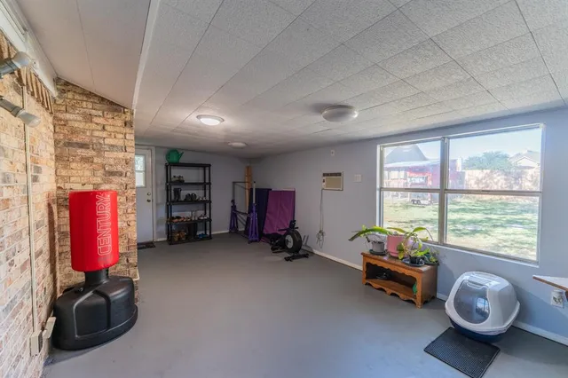a view of a room with furniture and a large window