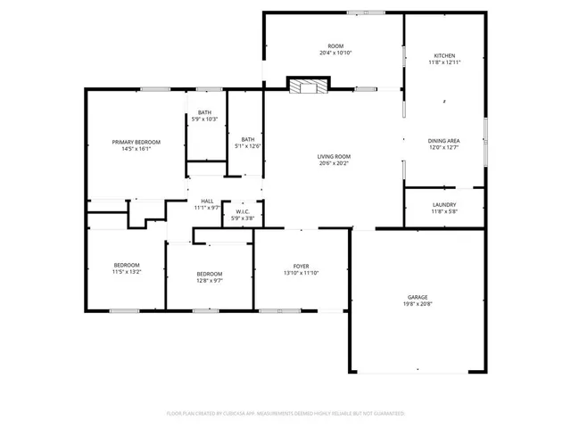 a view of a backyard with wooden fence and a large tree