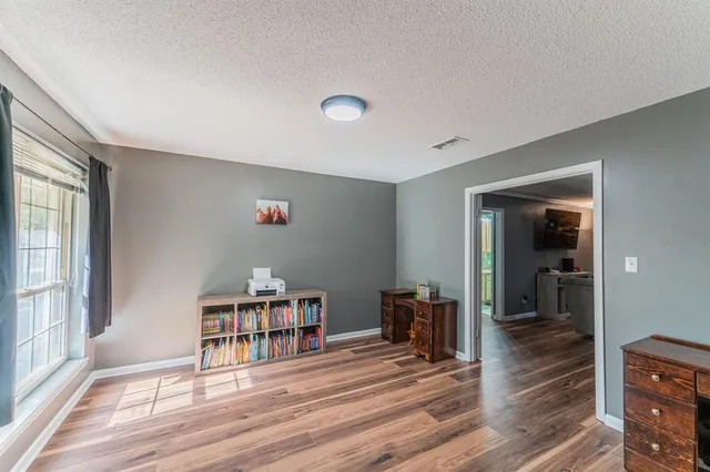 a room with furniture and wooden floor