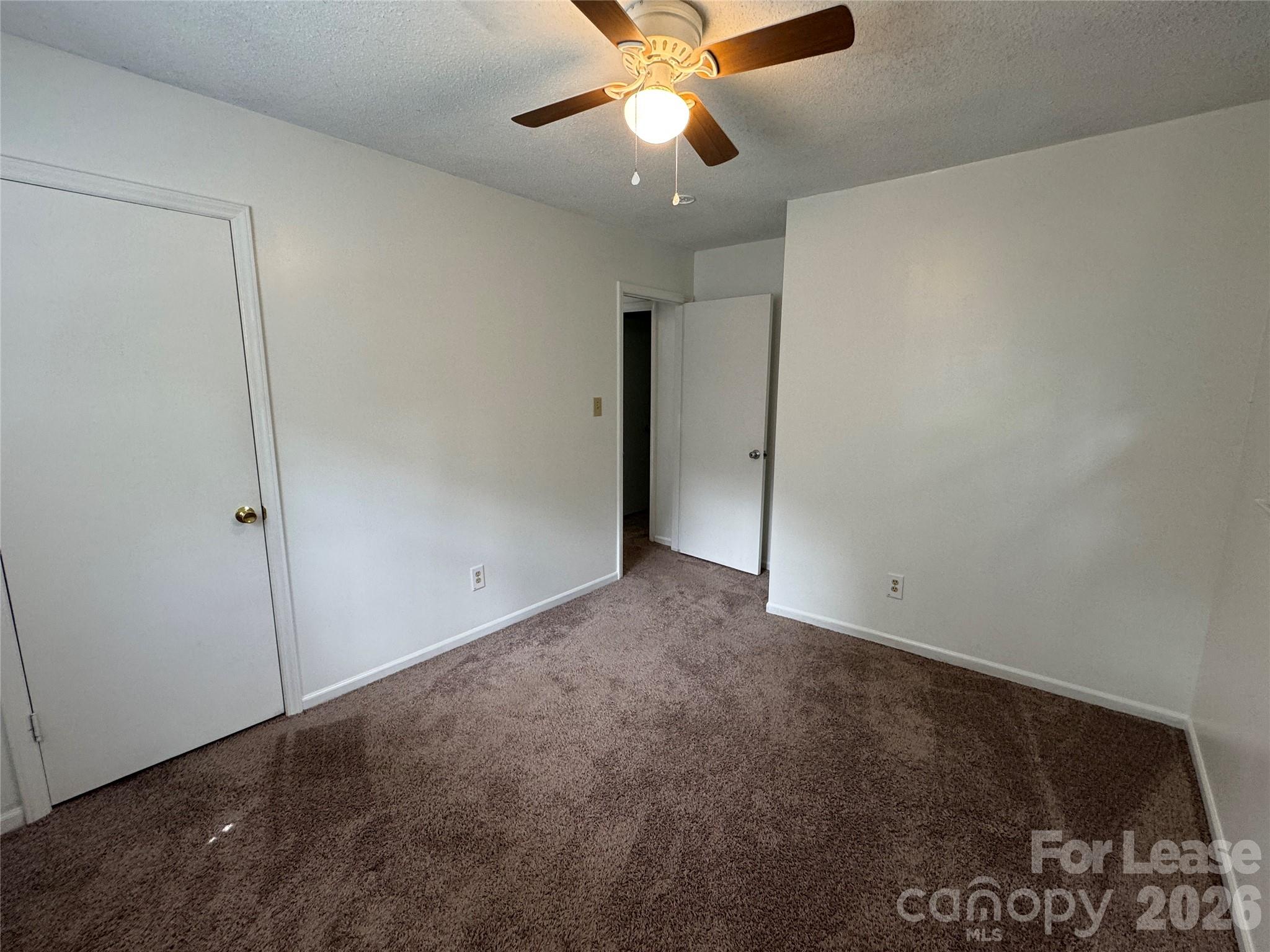 315 Pine Road Mount Holly, NC 28120 - Photo 12 of 21 a view of an empty room and chandelier fan