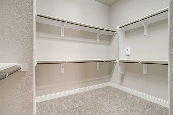 a view of an empty walk in closet