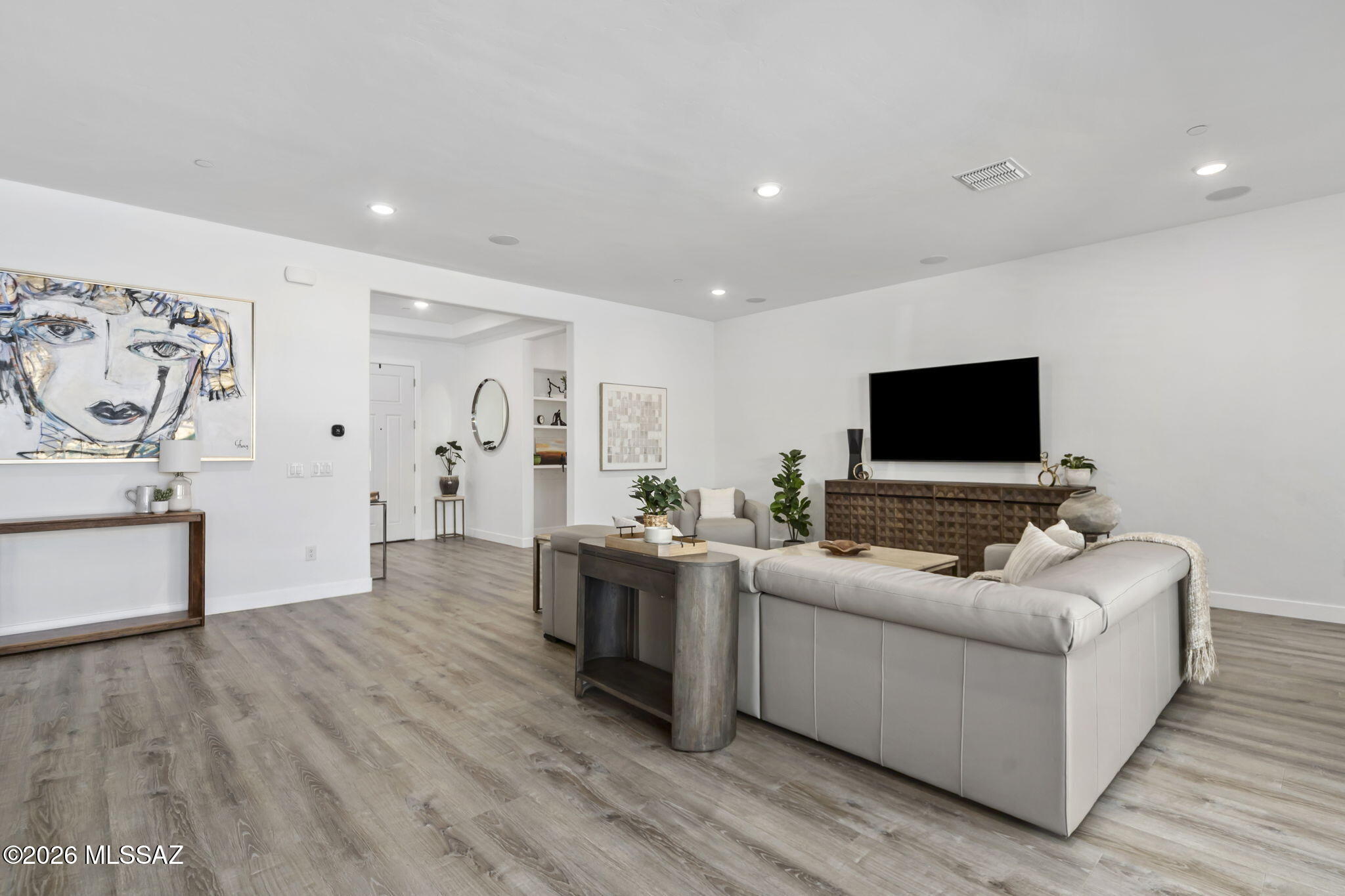 12791 East Tortoise Pointe Drive Vail, AZ 85641 - Photo 11 of 50 a living room with furniture and a flat screen tv